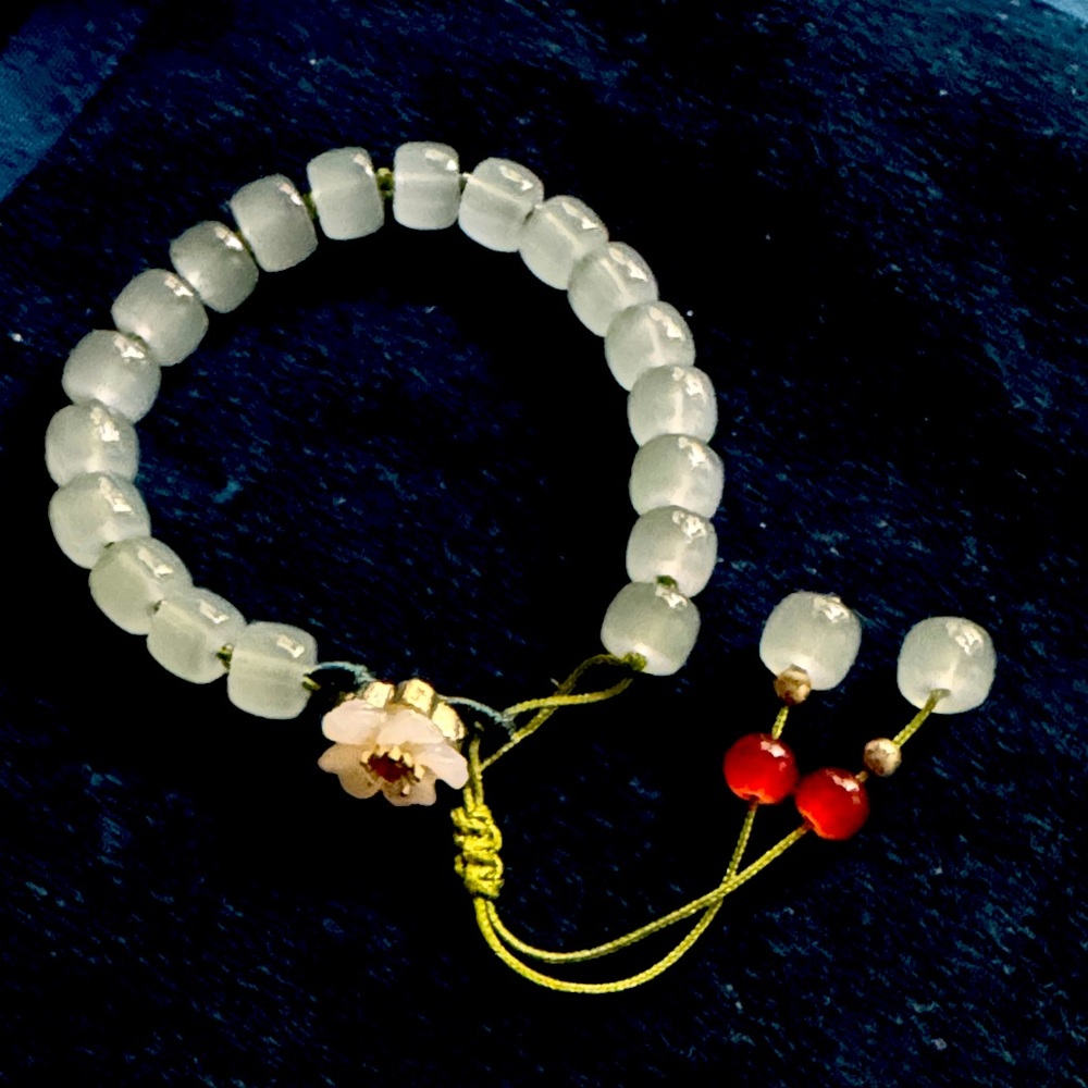 Elegant Beaded Bracelet with Floral Accent